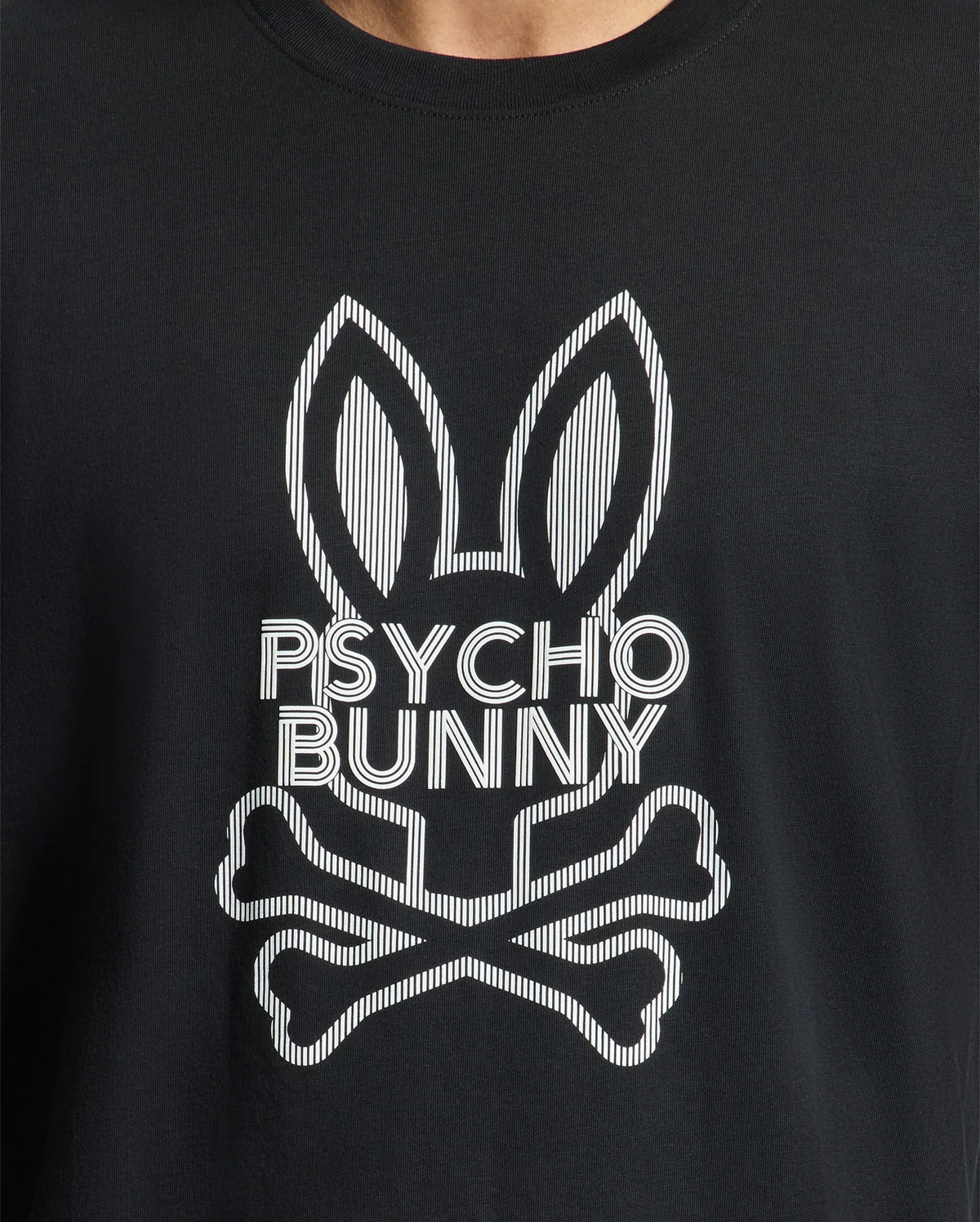 A close-up of the Psycho Bunny Men's Dumon Graphic Tee - B6U271E200, a black t-shirt made from premium Peruvian Pima Cotton, showcases a white stylized bunny with tall ears and crossbones beneath it, along with the "Psycho Bunny" text seamlessly incorporated into the design.