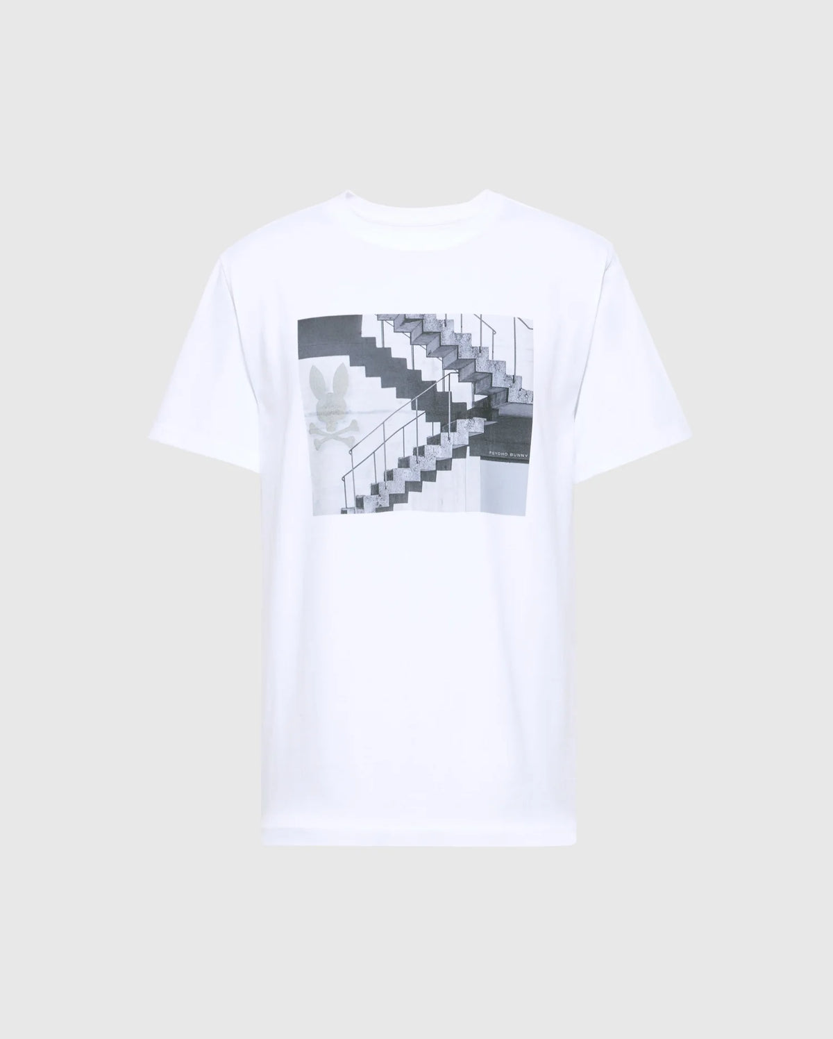 Psycho Bunny's MENS DEAN PHOTO REAL TEE - B6U390E200 is a white Pima cotton T-shirt featuring an urban geometric print of a black and white staircase with handrails, accented by a subtle floral design on the left side.