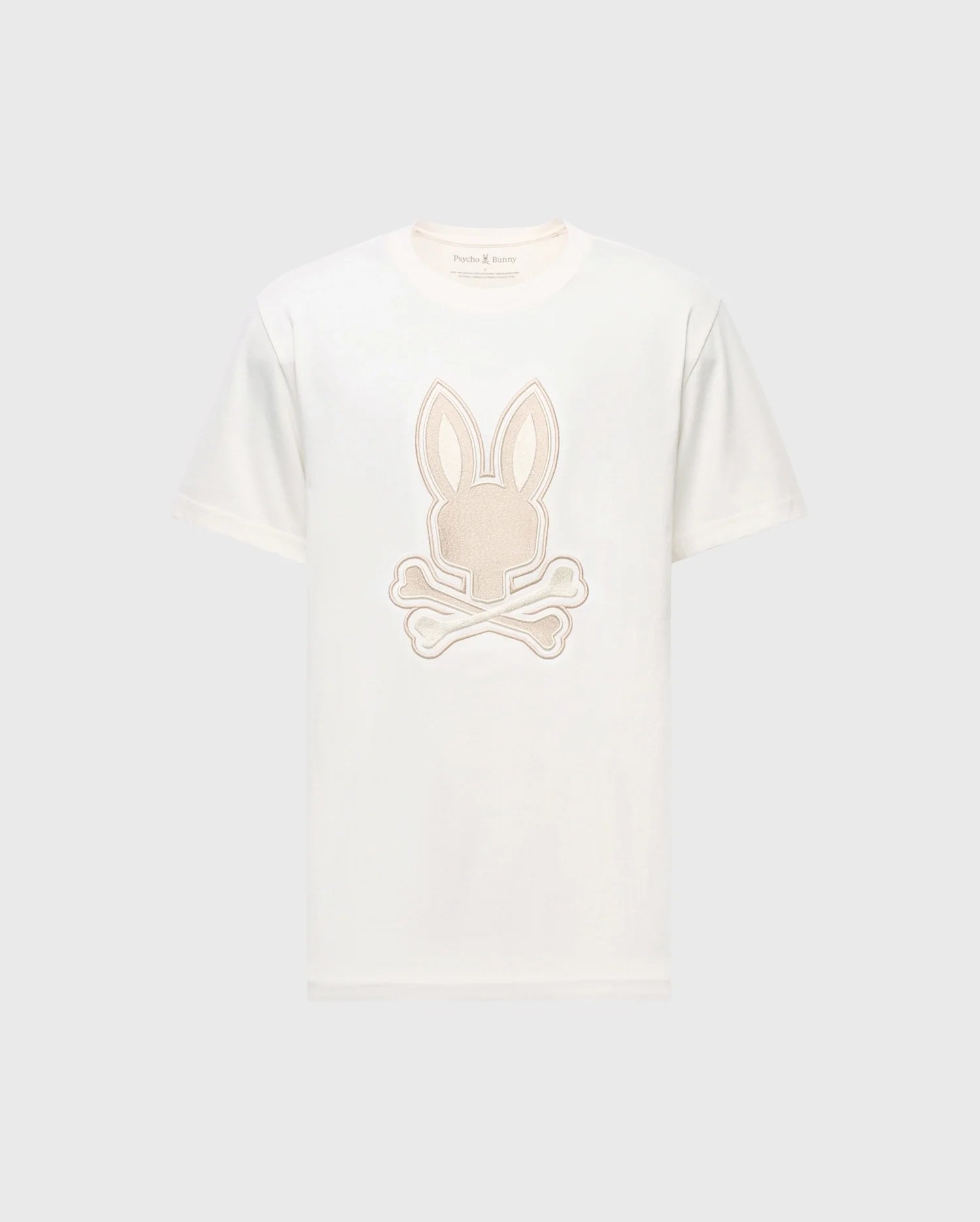 Check out the Psycho Bunny MENS NEW CASTLE GRAPHIC TEE, B6U415F200. This white Pima cotton T-shirt features an embroidered bunny head with ears and crossed bones in light beige, elegantly centered on the front.
