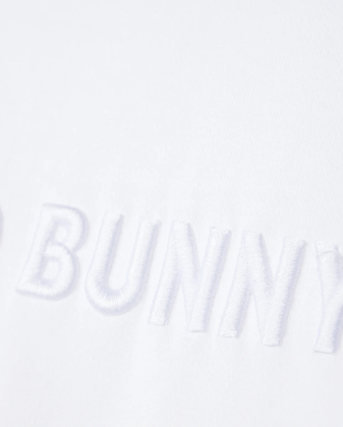close up of front wordmark graphic of the pima cotton windcrest heavy weight tee in white