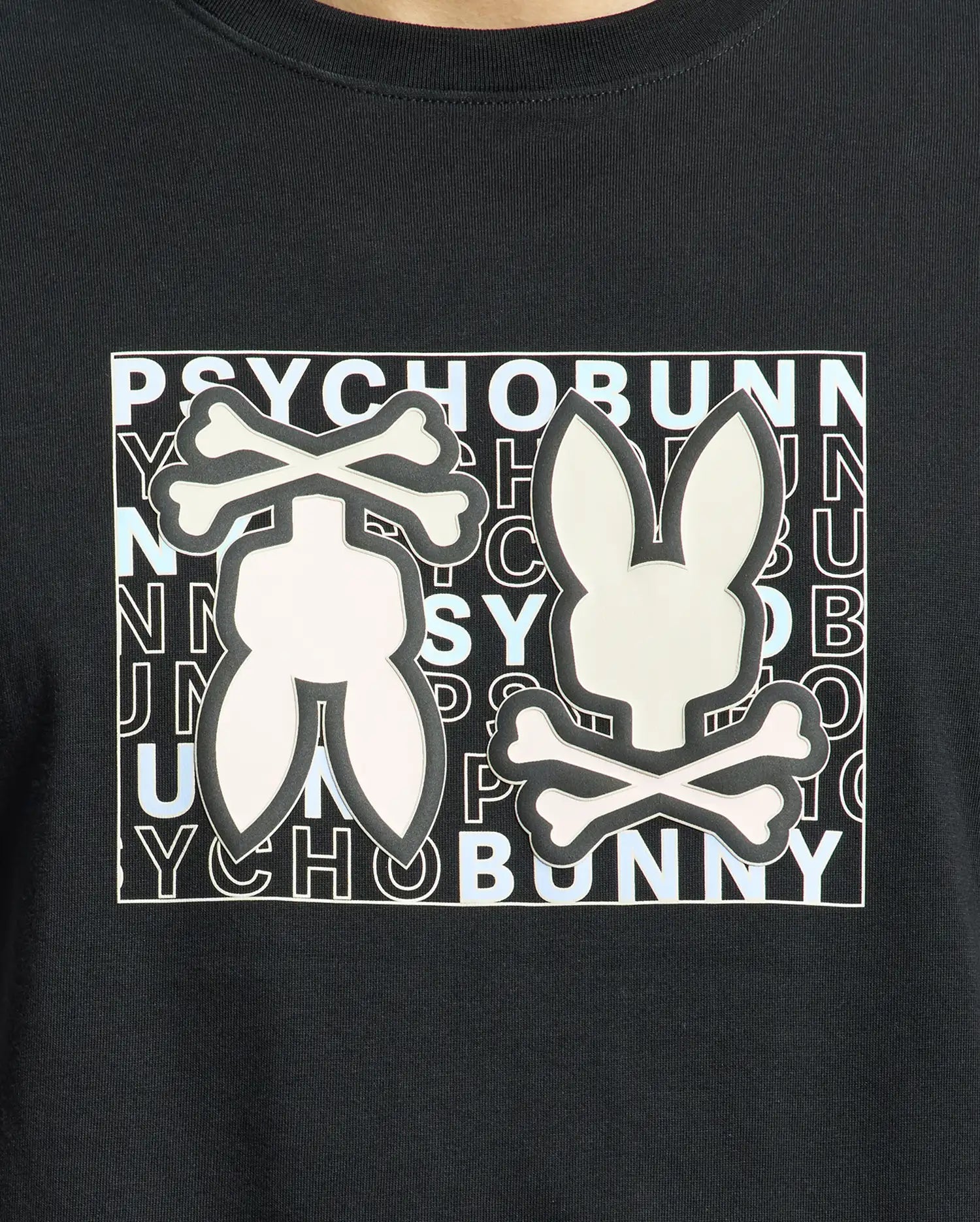The Psycho Bunny MENS GOLD COAST GRAPHIC TEE - B6U631F200, made from premium Pima cotton in a classic fit, features two stylized rabbit logos with crossbones and "PSYCHO BUNNY" in alternating black and white letters, combining unique design with exceptional craftsmanship.