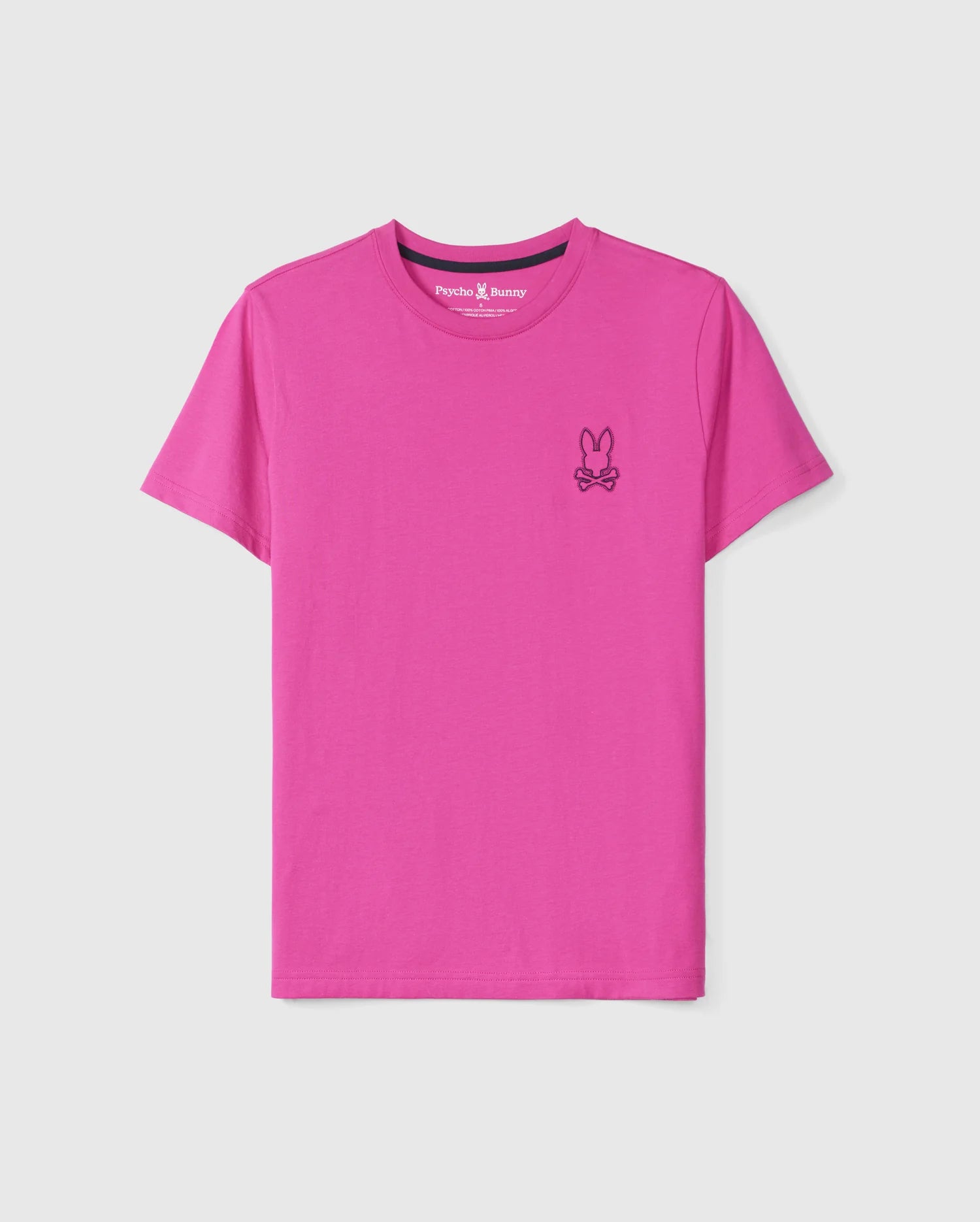 The MENS PEARLAND BACK GRAPHIC TEE - B6U632C200 by Psycho Bunny is a vibrant pink shirt made from soft Pima cotton, featuring a small embroidered bunny logo with crossed bones below it on the upper left side of the chest.
