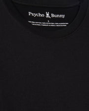 Close-up of a black t-shirt titled "MENS JAMES PREMIUM CREW NECK TEE - B6U952D200" by Psycho Bunny, showcasing the logo and text on the inside collar. Crafted from Premium Pima cotton, this shirt exhibits meticulous embroidery with a stylized bunny graphic. The fabric appears smooth, exemplifying excellence in Peruvian craftsmanship.