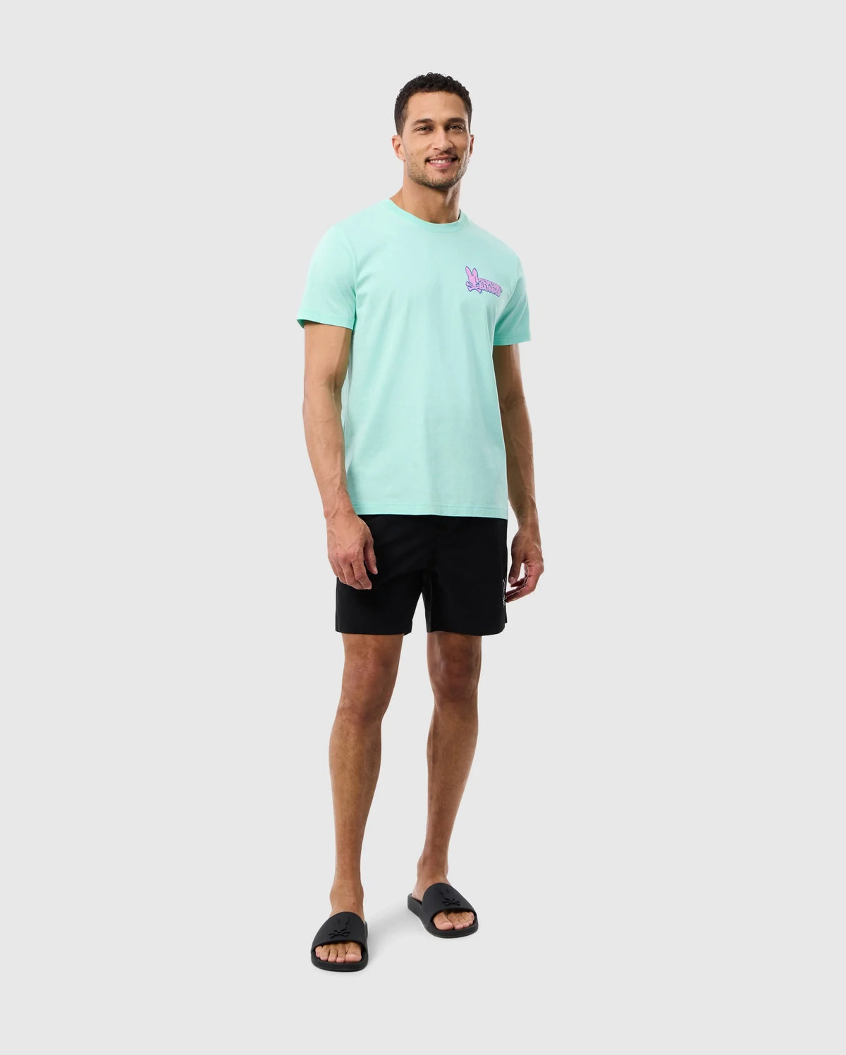 head to toe view of a model wearing the parker hydrochromic swim trunk