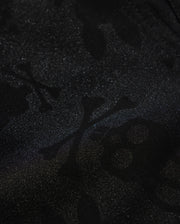 fabric detail of the parker hydrochromic swim trunk in black