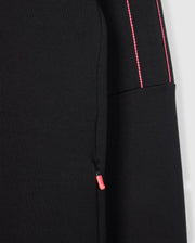 The BIG AND TALL TRAVIS TRACK JACKET by Psycho Bunny features cotton-blend sleeves with neon pink zippers and stitching, providing a vibrant contrast to the dark fabric for a modern, stylish look.
