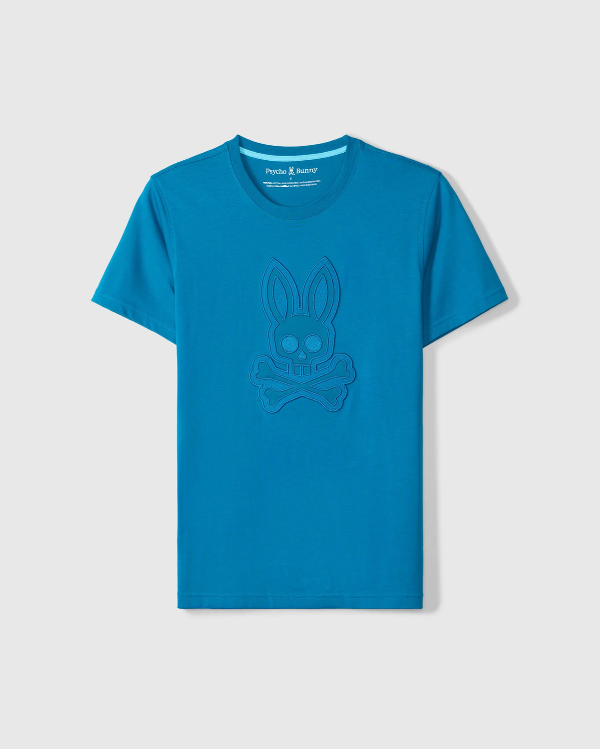 Discover the artistry of Peruvian craftsmanship with Psycho Bunny's blue BIG AND TALL MALTON GRAPHIC TEE, featuring an embossed rabbit skull and crossbones design. Crafted from soft Pima cotton, it subtly incorporates a logo on the inner neck label for understated elegance.