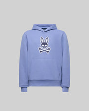 The KIDS RYDER BUNNY HOODIE - KT0500018 by Psycho Bunny is a light purple hoodie with a hood and front pocket, featuring a white embroidered bunny head and crossbones patch on the chest. Ideal loungewear in soft style.