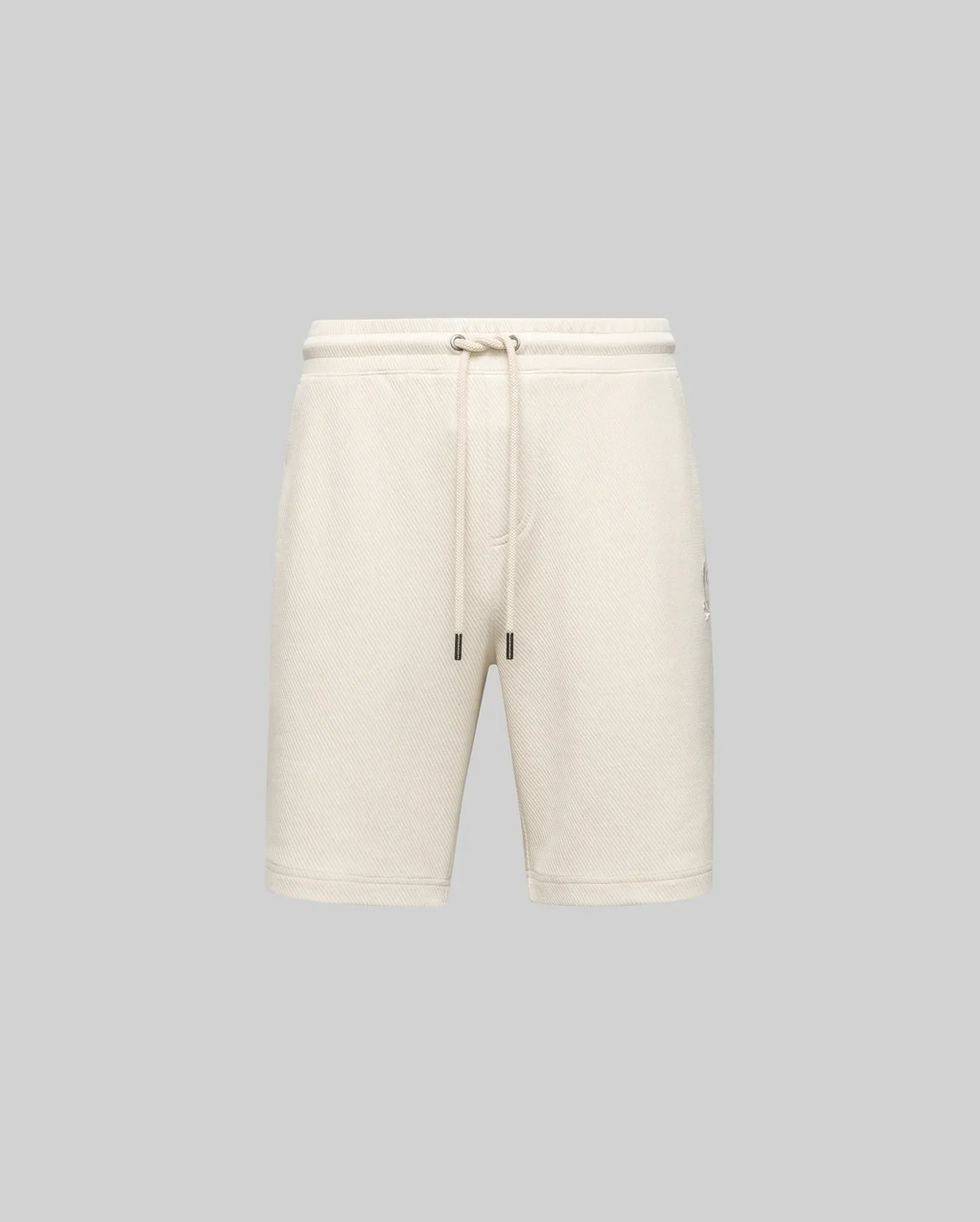 Psycho Bunny MENS KAI SWEATSHORT (MB0900015) in beige features a relaxed fit, elastic waistband with drawstring, and an embroidered Bunny logo, shown on a light gray background for a casual look.