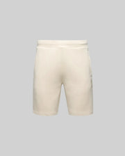 The Psycho Bunny MENS LAZSLO SWEATSHORT (MB0900016) features a beige, simple design with stretch modal-cotton-blend fabric, elastic waistband, side pockets, and embroidered Bunny detail, shown on a plain gray background.