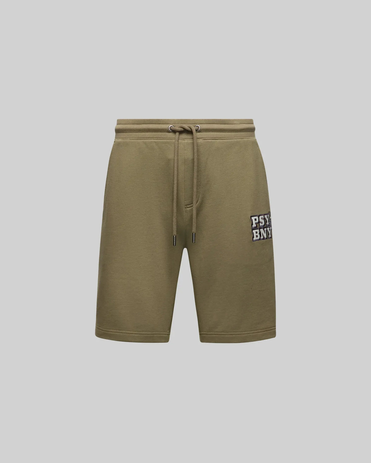 The MENS WADE SWEATSHORT - MB0900028 by Psycho Bunny features olive green, classic athletic style with side pockets, an embroidered "PSYBNY" patch on the left leg, and a premium cotton blend. Shown against a plain light gray background.