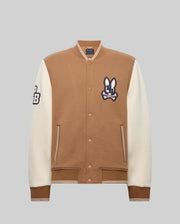 The Psycho Bunny MEN'S WADE KNIT BOMBER (MO1100020) features a tan body, white sleeves, an embroidered bunny "CB" logo on the chest, a "CB" patch on the sleeve, front pockets, and ribbed cuffs.