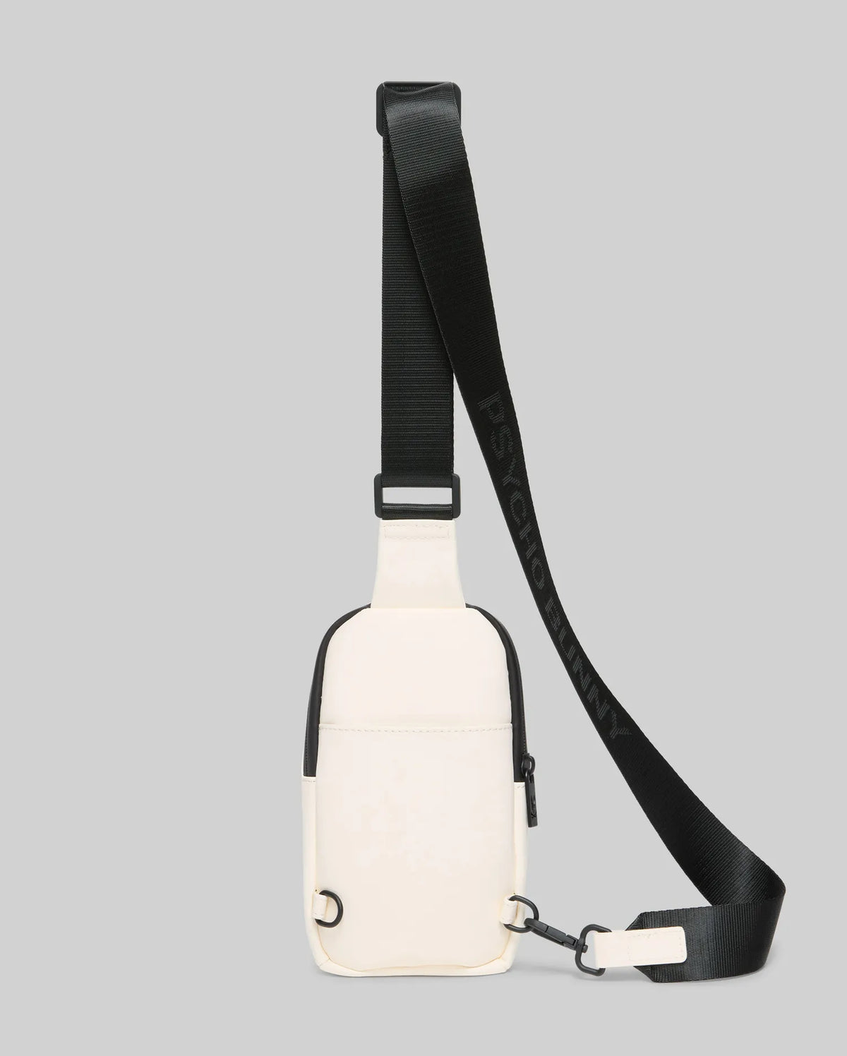 Mens Rubberized Crossbody in cream with sleek black trim, zippers, and hardware, featuring a smooth, durable texture and an adjustable black strap with repeated Psycho Bunny text branding.