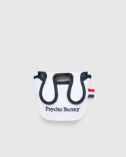 The MULTI BUNNY MALLET PUTTER COVER - PBMG4SH6 by Psycho Bunny is a small white pouch with black trim, featuring a red and blue striped tab, perfect as a golf accessory. The front is embroidered with "Psycho Bunny" in black. It has a rounded top flap and minimalist design ideal for mallet putters.