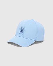 Light blue Psycho Bunny KIDS NEW CASTLE EMBROIDERED BASEBALL CAP (B0A547F200) with a stylized rabbit head and crossbones design, 100% cotton, curved brim, six panels, top button, ventilation eyelets, and adjustable strap.