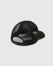 The image showcases the KIDS MELBOURNE GRAPHIC TRUCKER HAT from Psycho Bunny in black, featuring a solid front panel, mesh back, adjustable snap-back strap for a perfect fit, and an embroidered icon against the plain white background.
