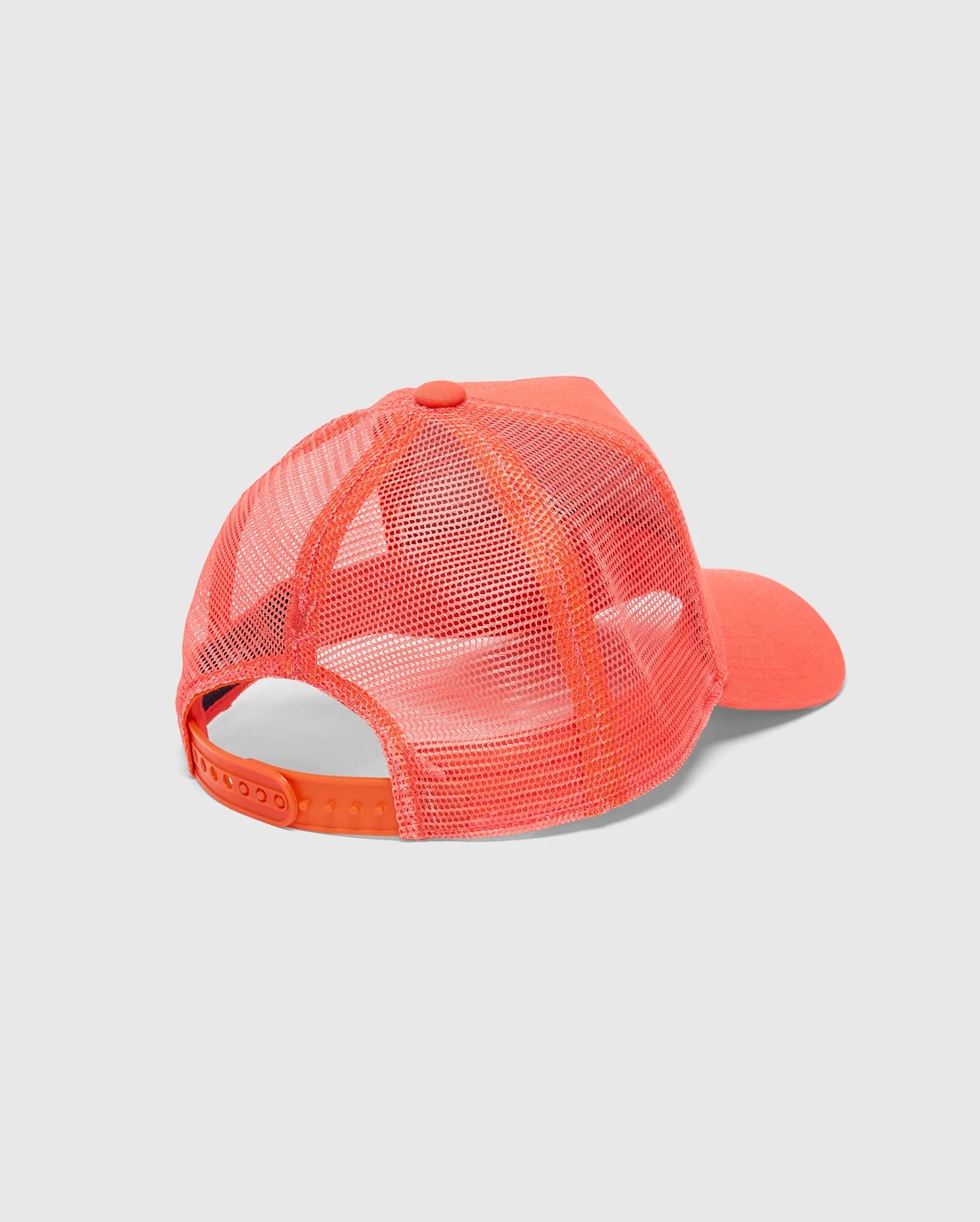 A vibrant orange "KIDS MELBOURNE GRAPHIC TRUCKER HAT - B0A548F200" by Psycho Bunny is seen from behind, featuring a mesh back and adjustable snap-back strap. The front shows a solid orange panel with a curved bill against a plain white background.