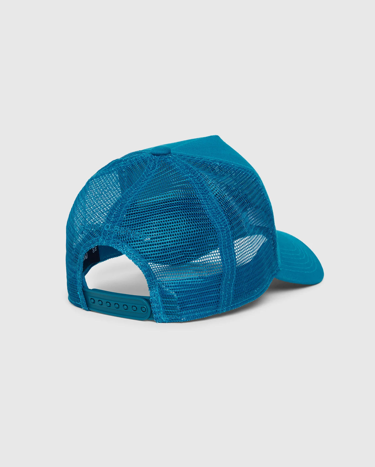 The rear view of the Psycho Bunny KIDS MALTON TRUCKER CAP (model B0A797D200) showcases its blue mesh-back design. This cap features an adjustable snapback closure and a curved brim. The mesh ventilation is more pronounced towards the back, seamlessly transitioning to a solid cotton fabric at the front. The cap is displayed against a plain gray background.