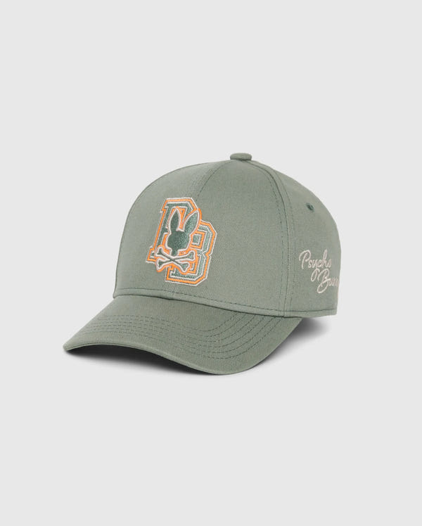 Introducing the KIDS ZACK BASEBALL CAP - B0A886D200 by Psycho Bunny: This sporty green cap is expertly crafted from woven cotton and features an embroidered "P" and "B" design on the front. "Psychic Blues" is elegantly stitched on the side, creating a perfect blend of style and comfort. The cap is presented against a plain white background for a clean look.