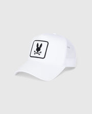 The KIDS BUNNY PATCH TRUCKER CAP - B0A965C200 by Psycho Bunny is a white mesh baseball hat displaying the brand's official logo. The patch features a playful bunny head above crossed bones silhouette, adding an edgy twist to its classic design.