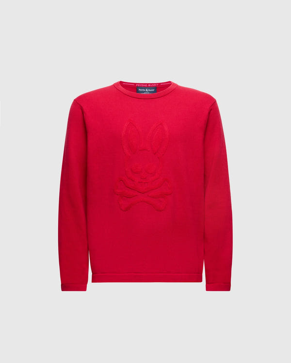 The KIDS COORY CHAINSTITCH COTTON SWEATER by Psycho Bunny features a vibrant design with a cartoon bunny and crossbones on fine cotton. It has long sleeves, a round neckline, and is set on a plain white background.