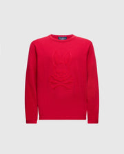 The KIDS COORY CHAINSTITCH COTTON SWEATER by Psycho Bunny features a vibrant design with a cartoon bunny and crossbones on fine cotton. It has long sleeves, a round neckline, and is set on a plain white background.