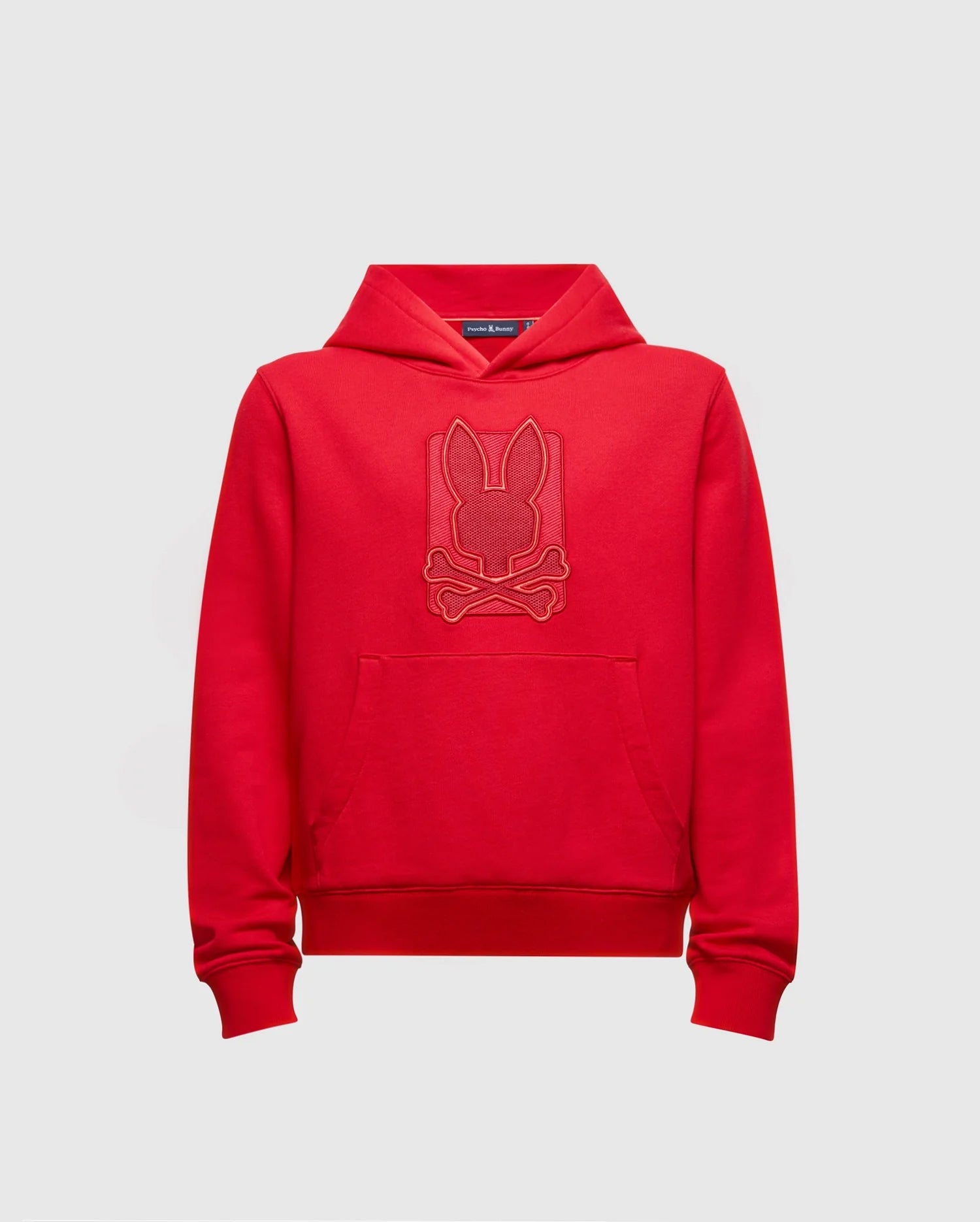 The Psycho Bunny KIDS PIERCE ESSENTIAL FRENCH TERRY HOODIE (B0H135E200) is crafted from comfortable French terry cotton and showcases a stylish front design featuring a bunny silhouette above crossbones. This pullover sweatshirt includes a practical front pocket and hood, all presented on a plain white background.
