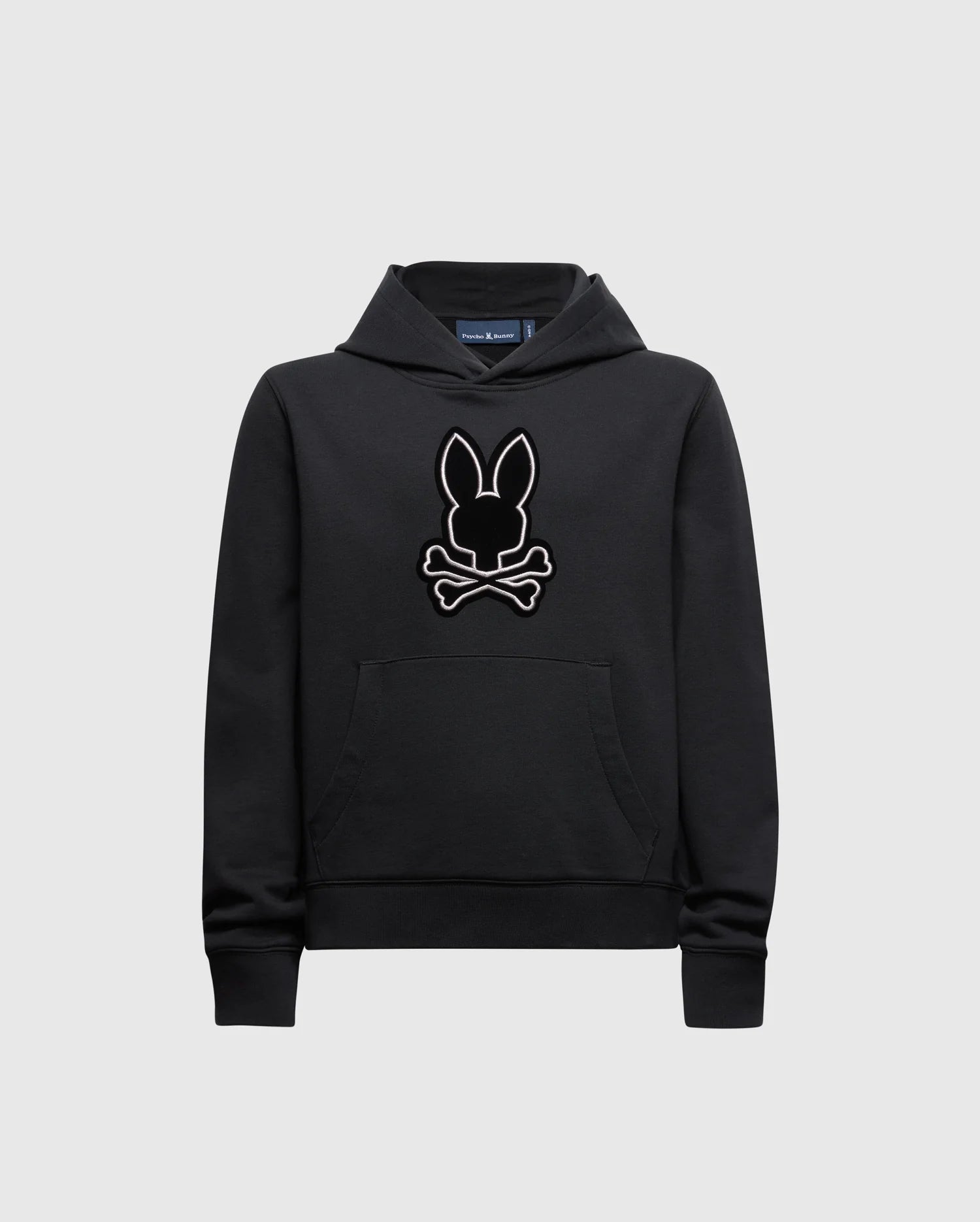 The KIDS ALEXANDER HOODIE - B0H154E200 by Psycho Bunny is a versatile pullover hoodie featuring a stylized bunny head logo with crossed bones beneath. Designed for comfort, it provides a relaxed fit with a front pocket and ribbed cuffs, making it an ideal choice as a kids' black hoodie.