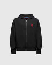 The Psycho Bunny Kids Pierce Essential French Terry Zip Hoodie (Product Code: B0H269E200) comes in black and is designed with convenient pockets. It features a small red emblem of a stylized animal on the chest, providing comfortable wear for everyday use.