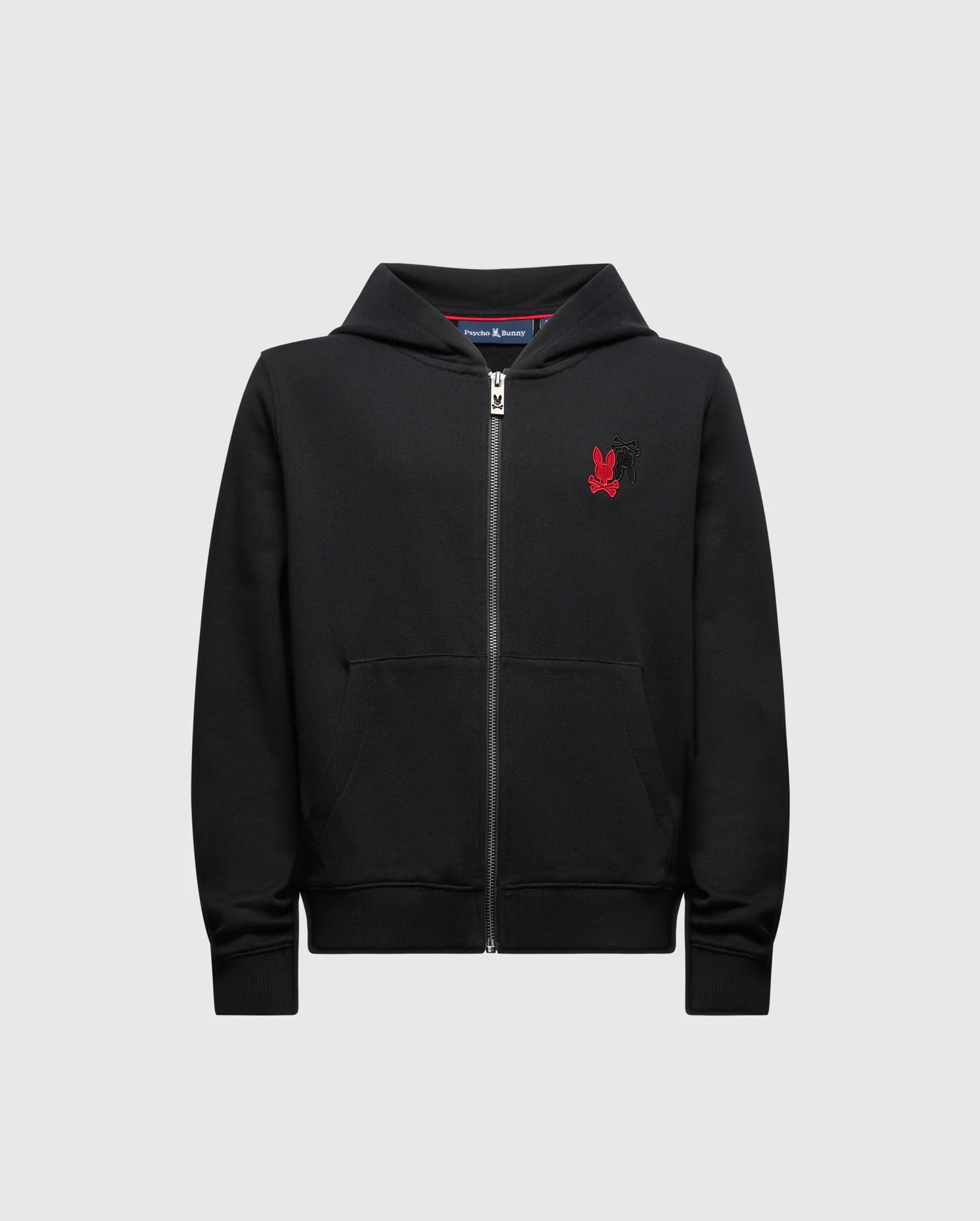 The Psycho Bunny Kids Pierce Essential French Terry Zip Hoodie (Product Code: B0H269E200) comes in black and is designed with convenient pockets. It features a small red emblem of a stylized animal on the chest, providing comfortable wear for everyday use.