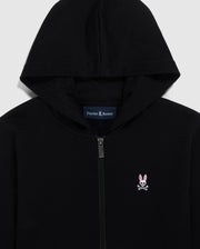 Close-up of a Psycho Bunny French terry zip hoodie in black with a silver zipper, featuring an embroidered Bunny logo on the left chest and the brand name 'Psycho Bunny' printed inside the collar.
