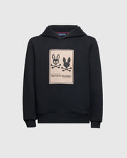The Kids Monroe Twill Patch Fleece Hoodie, by Psycho Bunny (B0H926D200), features a cozy French terry fabric with a beige rectangular logo appliqué displaying two stylized bunny logos and the "Psycho Bunny" text on the front.