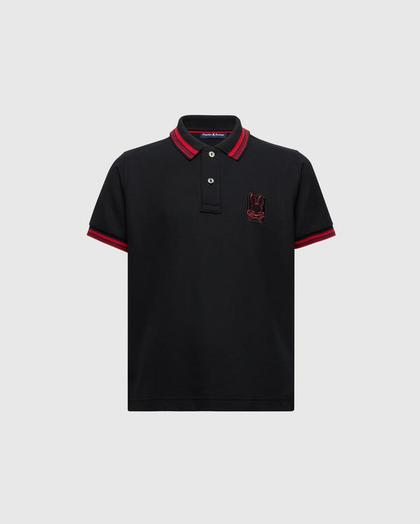 The KIDS PIERCE PIQUE POLO - B0K201E200 by Psycho Bunny is made from premium Pima cotton and features a timeless design with short sleeves. It includes red trim on the collar and sleeve hems, buttons near the collar, and an embroidered red bunny logo on the left chest.