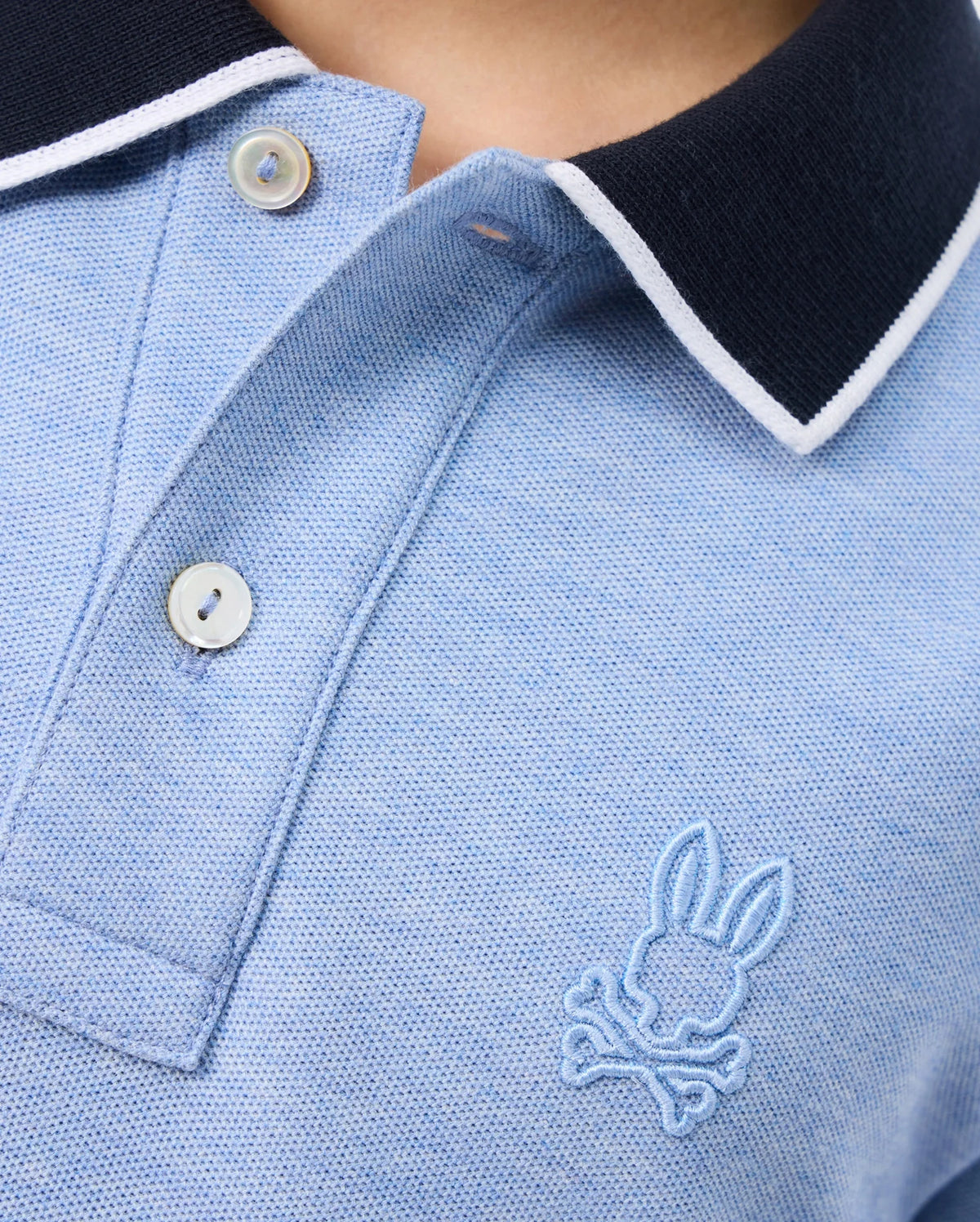 A close-up of a KIDS WINDCREST PIQUE POLO SHIRT - B0K592C200 by Psycho Bunny featuring a stylish striped collar.