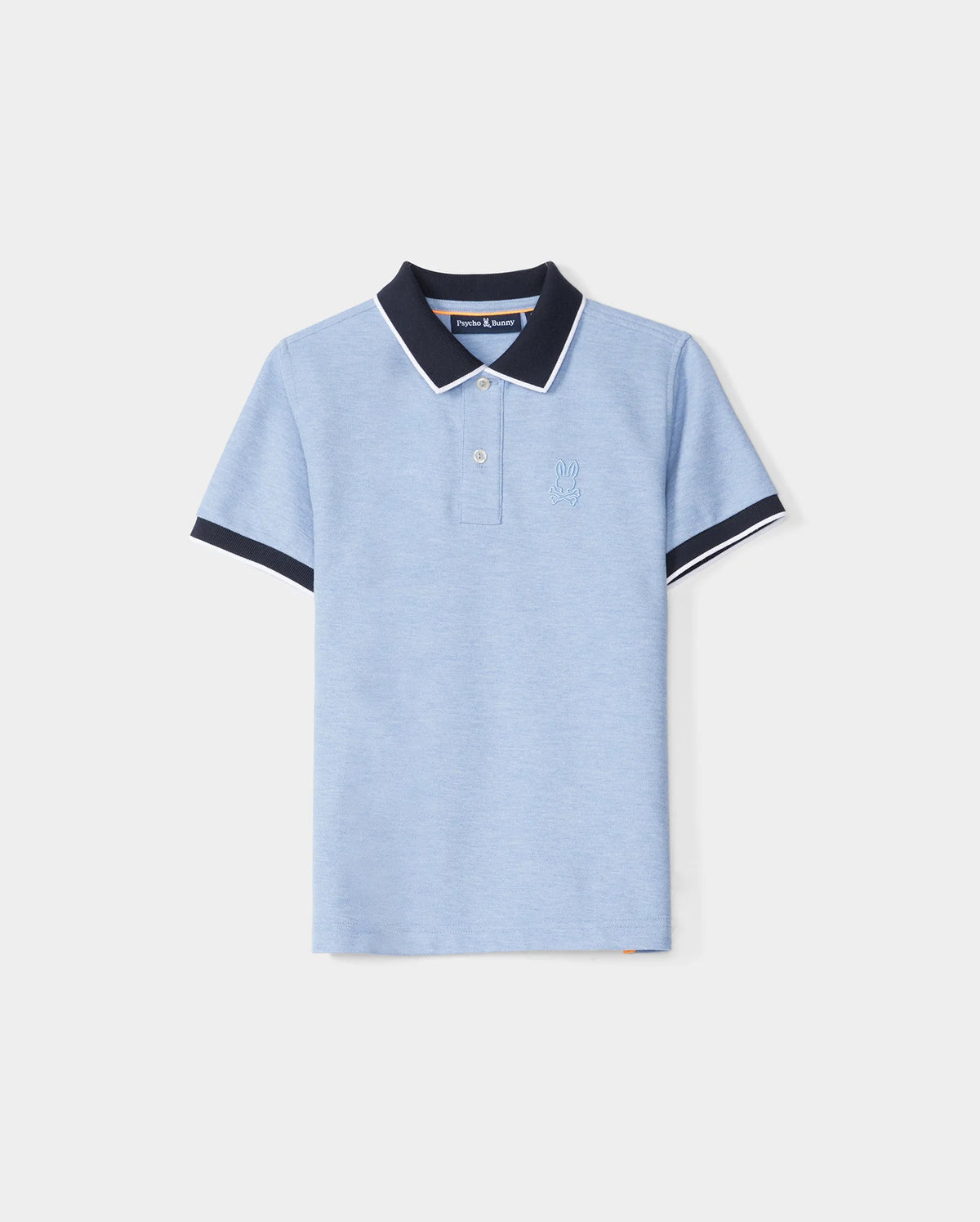 A KIDS WINDCREST PIQUE POLO SHIRT - B0K592C200 in light blue with a color blocked collar and sleeve trim. The dark blue collar features a white stripe on the edge, and the shirt has two buttons at the neckline. A raised-embroidered chest Bunny adorns the left chest area, set against a plain white background by Psycho Bunny.