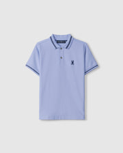 The Kids Riviera Pique Polo Shirt (B0K640C200) by Psycho Bunny is a light blue polo made from Pima cotton piqué. It features short sleeves and a collar, both trimmed with dark blue stripes, along with an embroidered dark blue Bunny logo on the left chest.