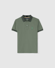 The Psycho Bunny Kids Malton Piqué Polo Shirt (B0K950D200) is designed in a soft pima cotton and showcases short sleeves with a two-button placket. It features thin, dark green stripes on the collar and diamond piqué-patterned cuffs, complemented by an embroidered small bunny emblem on the left chest.