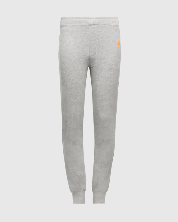 Psycho Bunny's KIDS VAL WAFFLE PANT (B0P673E200) in gray, made from soft Pima cotton and designed with elastic waistband and cuffs. These pants are adorned with a small orange embroidered logo on the upper left side, ideal for stylish lounging. The backdrop is a plain white setting.