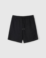 A pair of black athletic shorts with an elastic waistband and a drawstring. The slim fit shorts feature two side pockets and a small embroidered Bunny logo on the bottom left front. Made from a Stretch TENCEL-blend, they are displayed on a plain white background. The product is the KIDS WILLIS STRETCH TENCEL SHORT - B0R239Y1WB by Psycho Bunny.