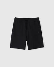A pair of black athletic shorts with an elastic waistband and drawstring. Crafted from Pima cotton piqué, these KIDS STANFORD LIGHT PIQUE SWEATSHORT - B0R344B200 by Psycho Bunny feature two front pockets and a small embroidered emblem on the right pocket. A stylish wardrobe staple against a plain white background.