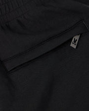 A close up of a Psycho Bunny KIDS LYONS SWEATSHORT - B0R578C200 fleece pocket.