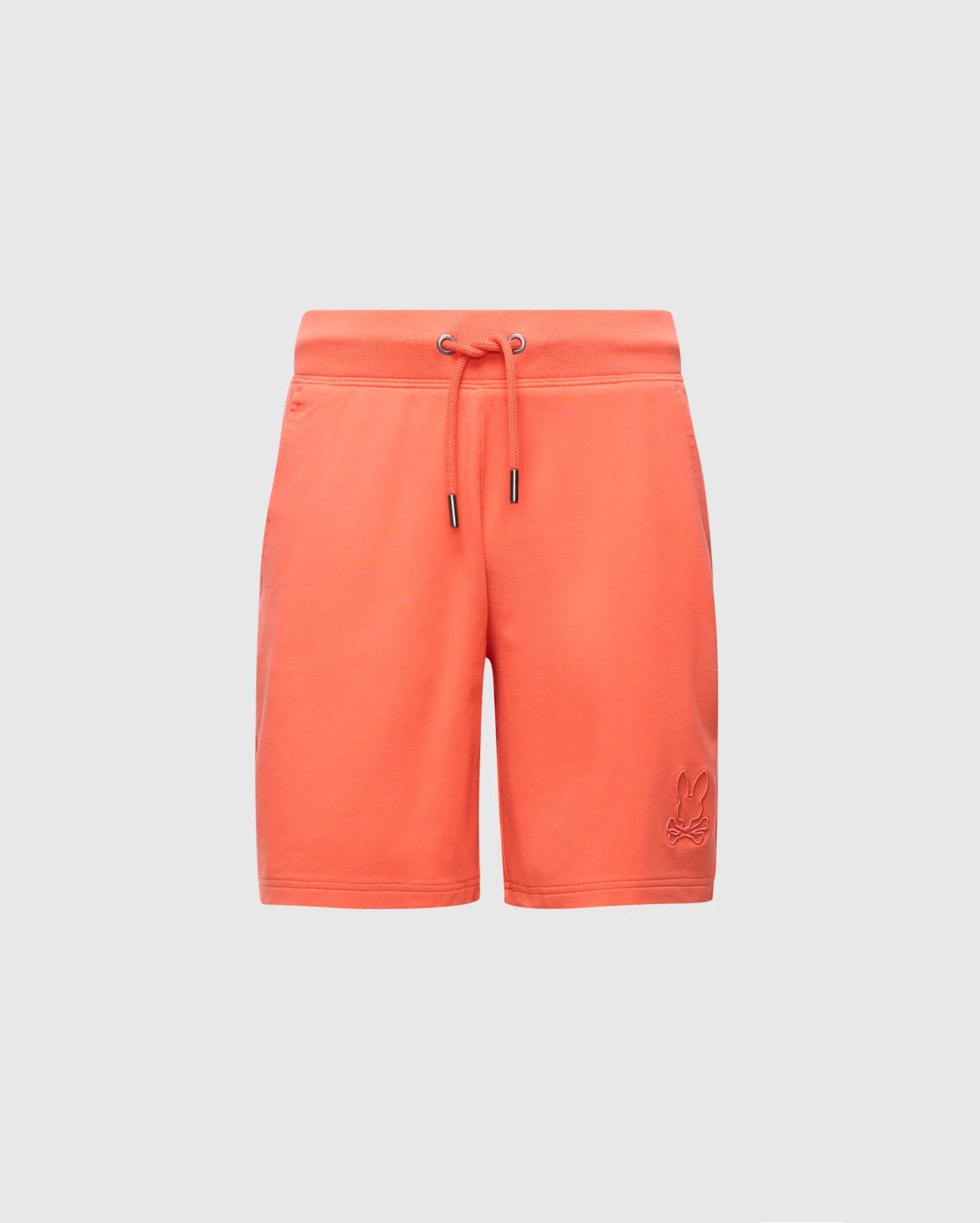 Psycho Bunny's KIDS LEVANZO FRENCH TERRY SWEATSHORT, model B0R578F200, features an orange hue with a drawstring waist and an embroidered logo on the left leg. Crafted from micro French terry, they offer a simple, casual design against a plain gray background.