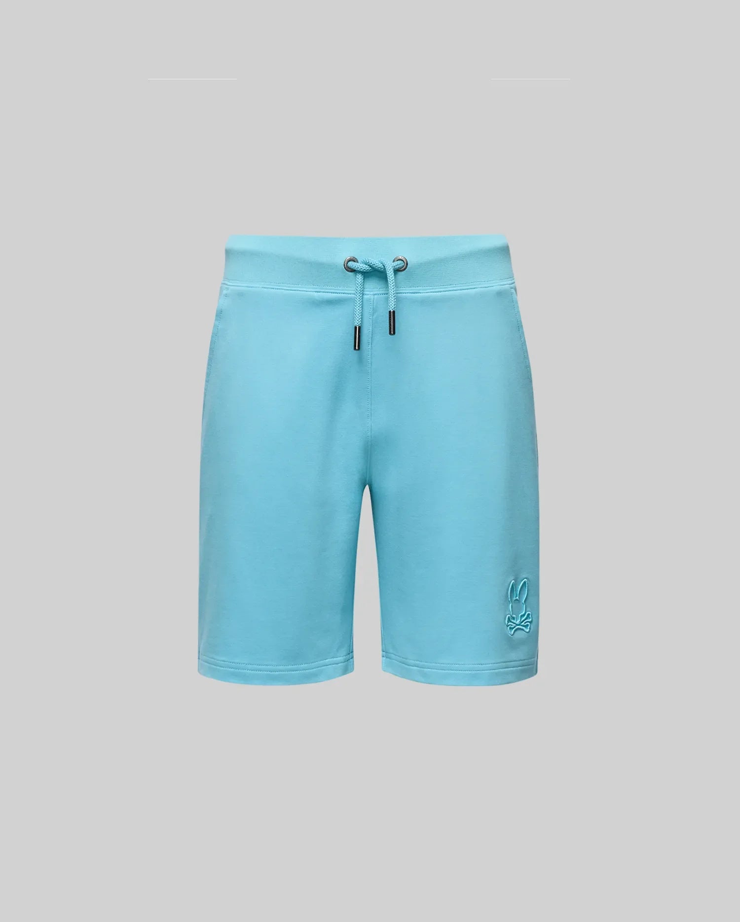 The Psycho Bunny KIDS LEVANZO EMBROIDERED MICRO FRENCH TERRY SWEATSHORT (B0R578F200) in light blue, shown on a plain gray background, features soft micro French Terry fabric and an embroidered bunny logo on the lower left leg.