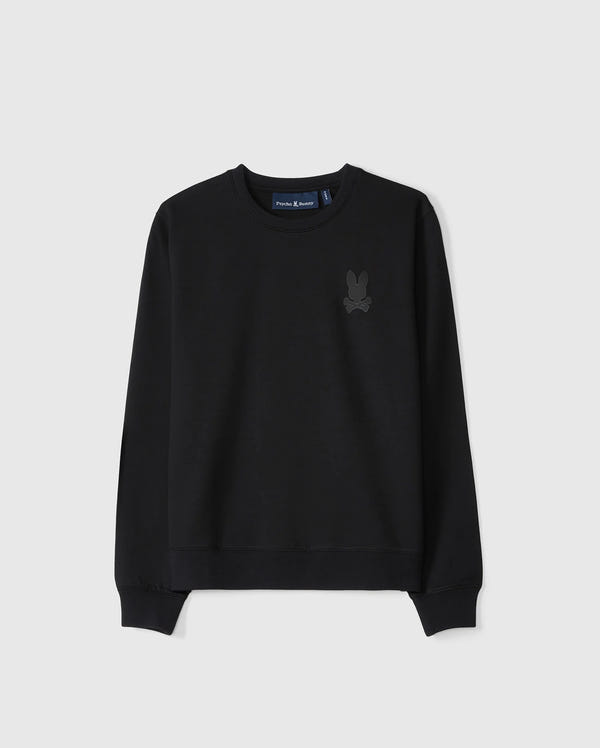 The KIDS HOUSTON FRENCH TERRY CREWNECK by Psycho Bunny is a black pullover sweatshirt made from premium cotton fabric. It features a subtle embossed bunny graphic on the upper left chest and has ribbed cuffs along with a ribbed hem, all set against a light gray background.