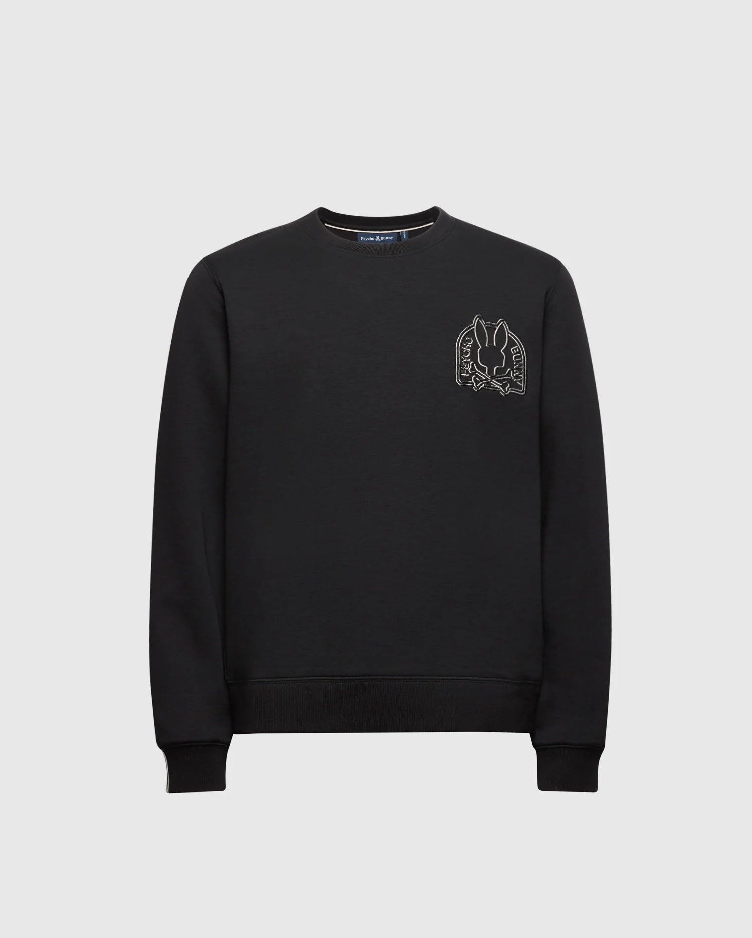 The Kids Melbourne Classic Crewneck Sweatshirt by Psycho Bunny, crafted from a soft stretch Modal blend, features a minimalist look with an embroidered design of two hands framing a dove on the upper left side, providing both comfort and elegance.