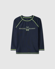 This navy kids' long-sleeve rash guard (B0T557C200) by Psycho Bunny features green trim and a central logo design. Crafted from quick-drying fabric, it offers UPF 50+ protection, ideal for sun-safe adventures.
