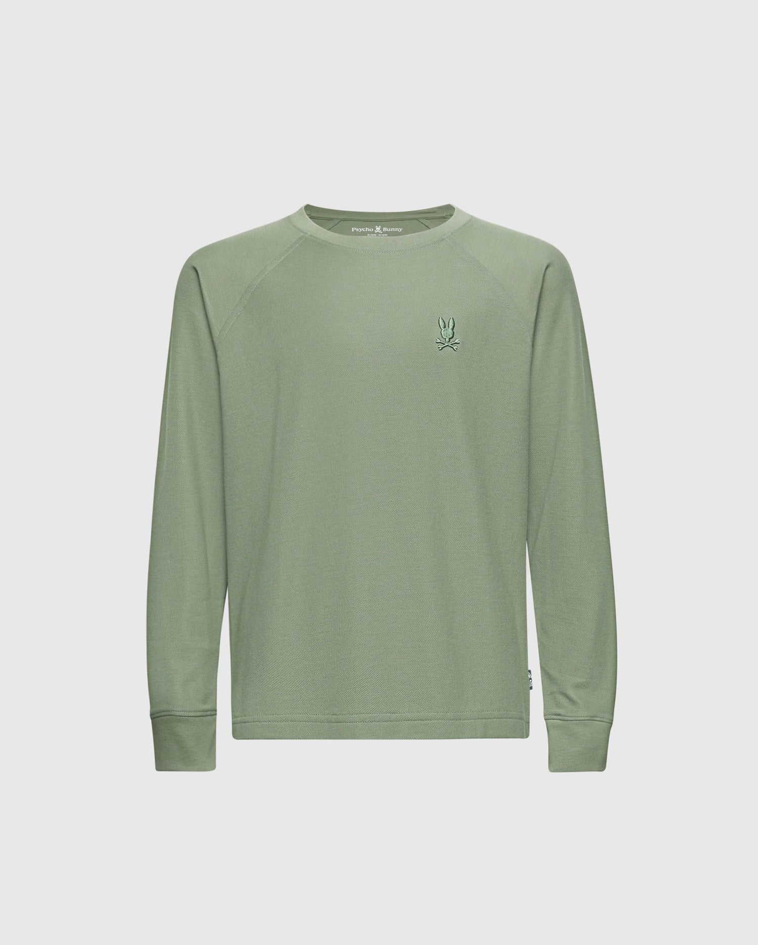 The Psycho Bunny KIDS TAYLOR PIQUE LONG SLEEVE TEE - B0T580F200 is a light green tee featuring an embroidered Bunny logo on the chest. With a round neckline, it's crafted from luxurious Pima cotton, offering a smooth texture and casual, simple design.