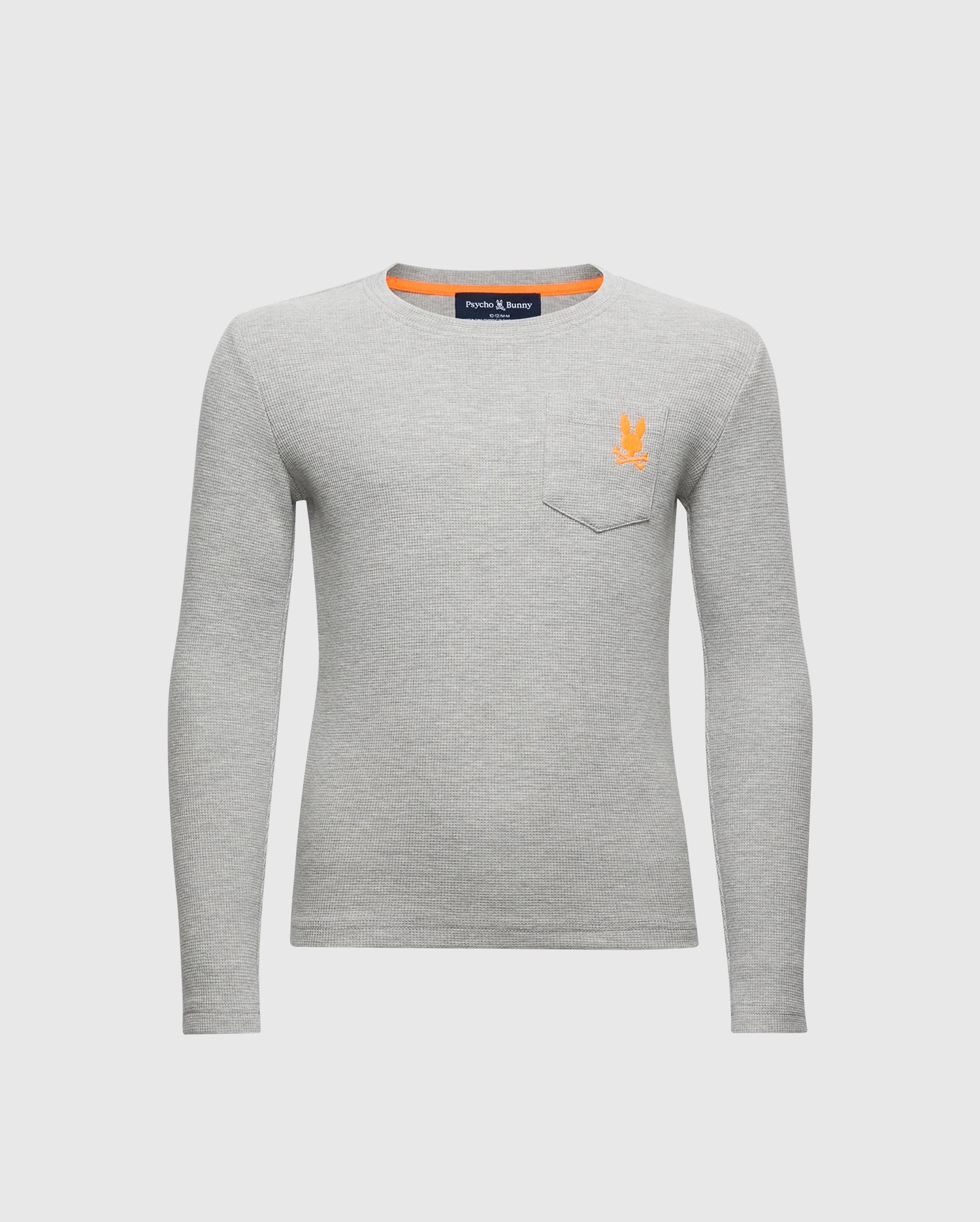 The Psycho Bunny KIDS VAL WAFFLE LONG SLEEVE TEE - B0T672E200 in light gray features a left chest pocket and an orange embroidered logo. Its simple design, crafted from soft Pima cotton, is highlighted against a plain white background.