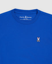 The KIDS CLASSIC CREW NECK TEE - B0U014CRPC by Psycho Bunny is a royal blue T-shirt crafted from soft Pima cotton. It features a small embroidered logo on the chest of a pink-eared bunny with crossbones, and the neckline label reads "Psycho Bunny," infusing playful style into this classic shirt.