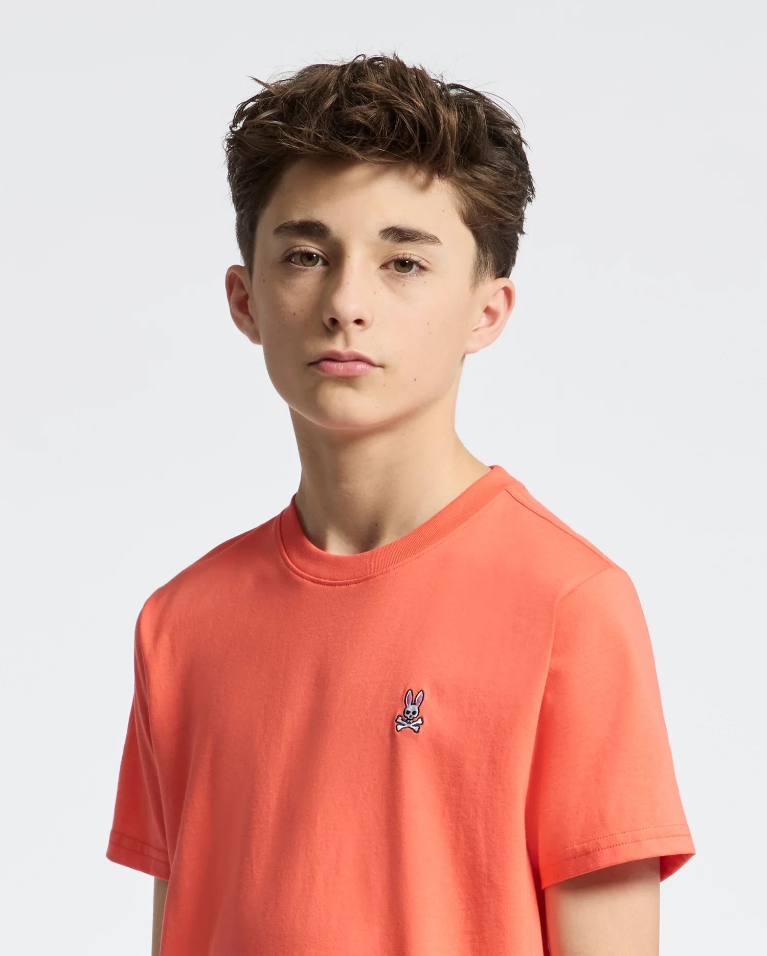Teen | Kids' Classic Crew Neck Tee in hot coral by Psycho Bunny, featuring a soft cotton design and embroidered logo for a bold, stylish look.